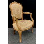 A Louis XV revival carved beech fauteuil armchair.