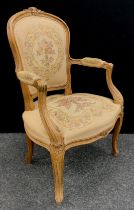 A Louis XV revival carved beech fauteuil armchair.