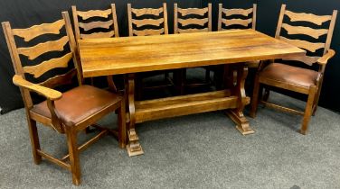 An oak plank-top trestle table, and set of six dining chairs (including two carvers), by Andrew