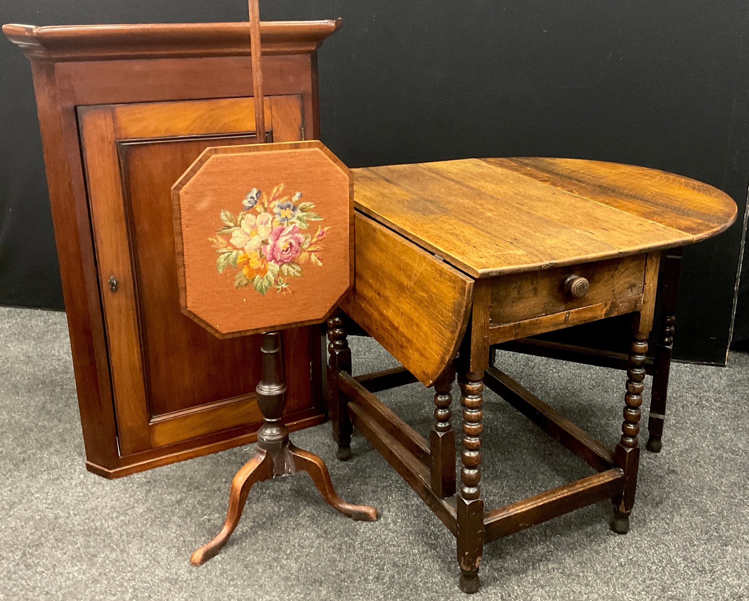 A 19th century mahogany corner cupboard; an 18th century oak drop-leaf table; a 19th century