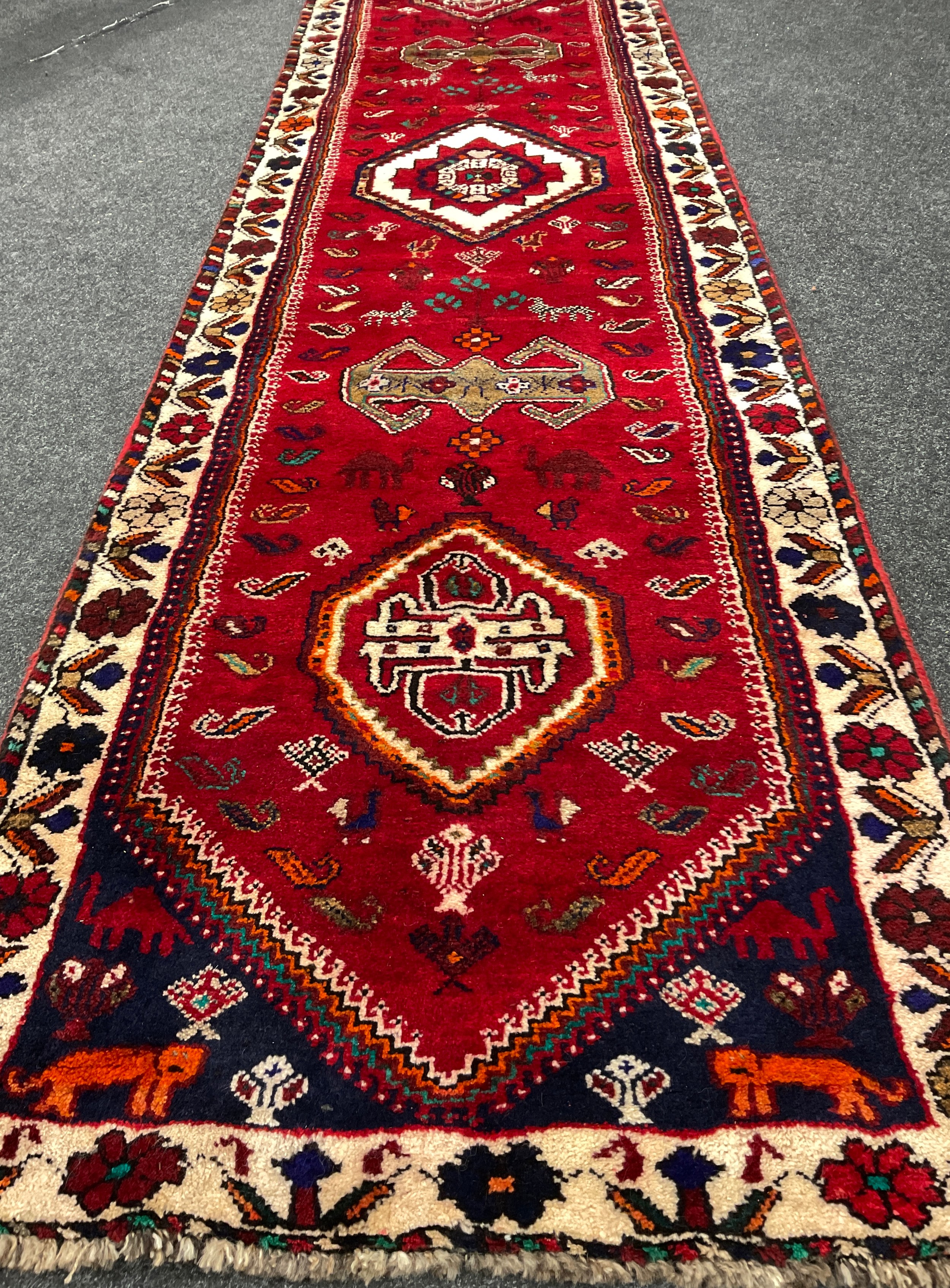 A South-west Persian Qashgai runner carpet, hand-knotted in rich colours, with five medallions, - Image 2 of 3
