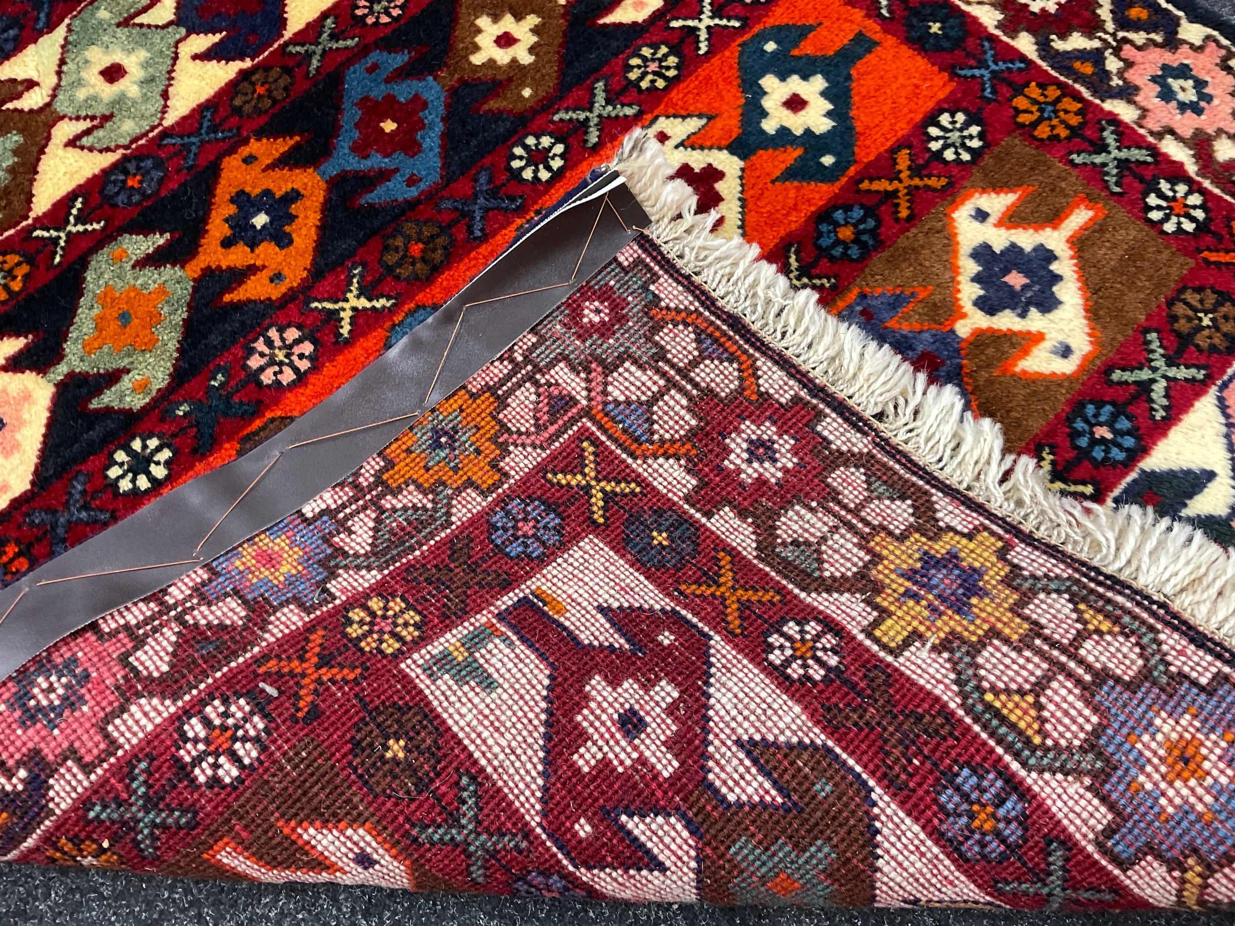 A North-west Persian Yallemeh rug / carpet, hand-knotted in rich tones of red, blue, orange, and - Image 2 of 2