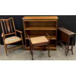 An Edwardian beech and walnut armchair; oak three tier open bookcase; piano seat; drop-leaf