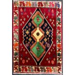 A South-west Persian Qashgai rug / carpet, hand-knotted with a triple medallion, within a field of