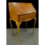 An early 20th century mahogany crossbanded walnut bureau, c.1930