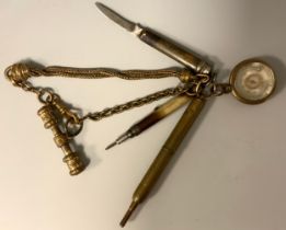 A fancy link gilt metal Albertina chain, suspending combination compass thermometer, folding