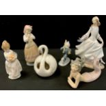 Lladro figures including; Mermaid, 16cm long, globular formed swan, 14cm high, Dashing lady, 25cm