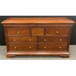A Willis and Gambier ‘Antoinette’ model (or similar) sideboard / large chest of drawers, the rounded