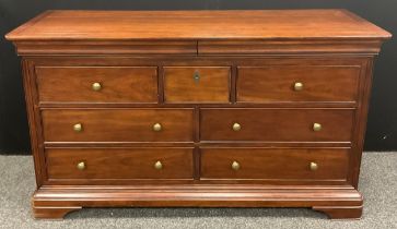 A Willis and Gambier ‘Antoinette’ model (or similar) sideboard / large chest of drawers, the rounded