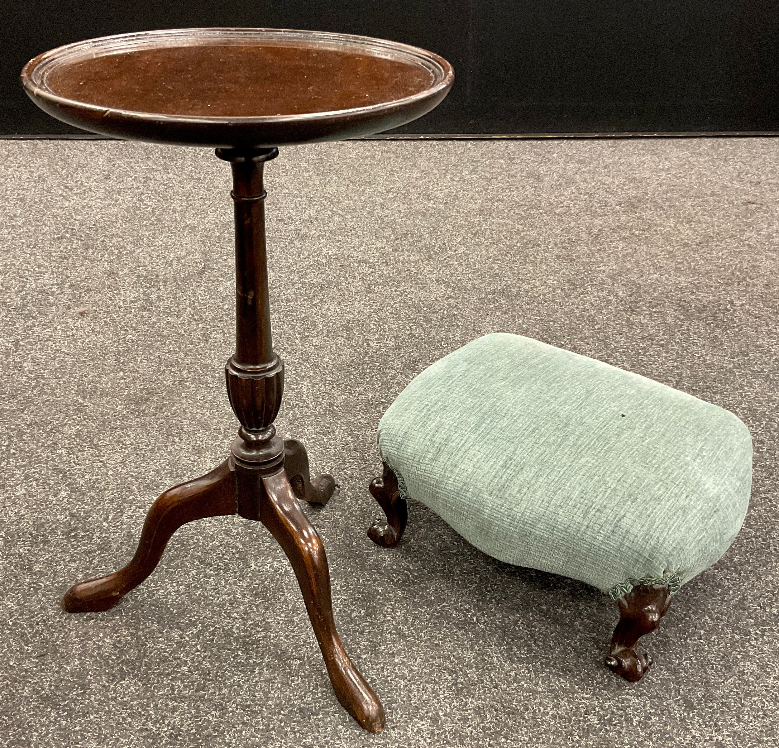 A 19th century footstool, serpentine-shaped top, cabriole legs with carved scroll terminals, 15cm