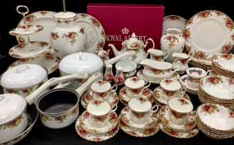 A extensive Royal Albert ‘Old Countryroses’ table service for six comprised of; six dinner plates,