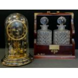 A Bohemian crystal glass two bottle tantalus, The Time 1990 competition Prize, 35.5cm x 27.5cm, with