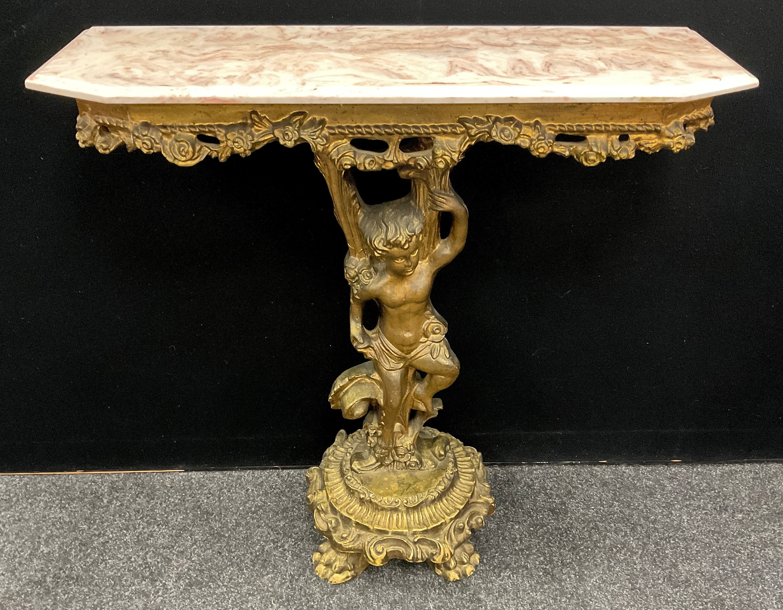 A Neo-classical revival hall table, ‘gilt’ painted pedestal base with a Putti, single arm held aloft