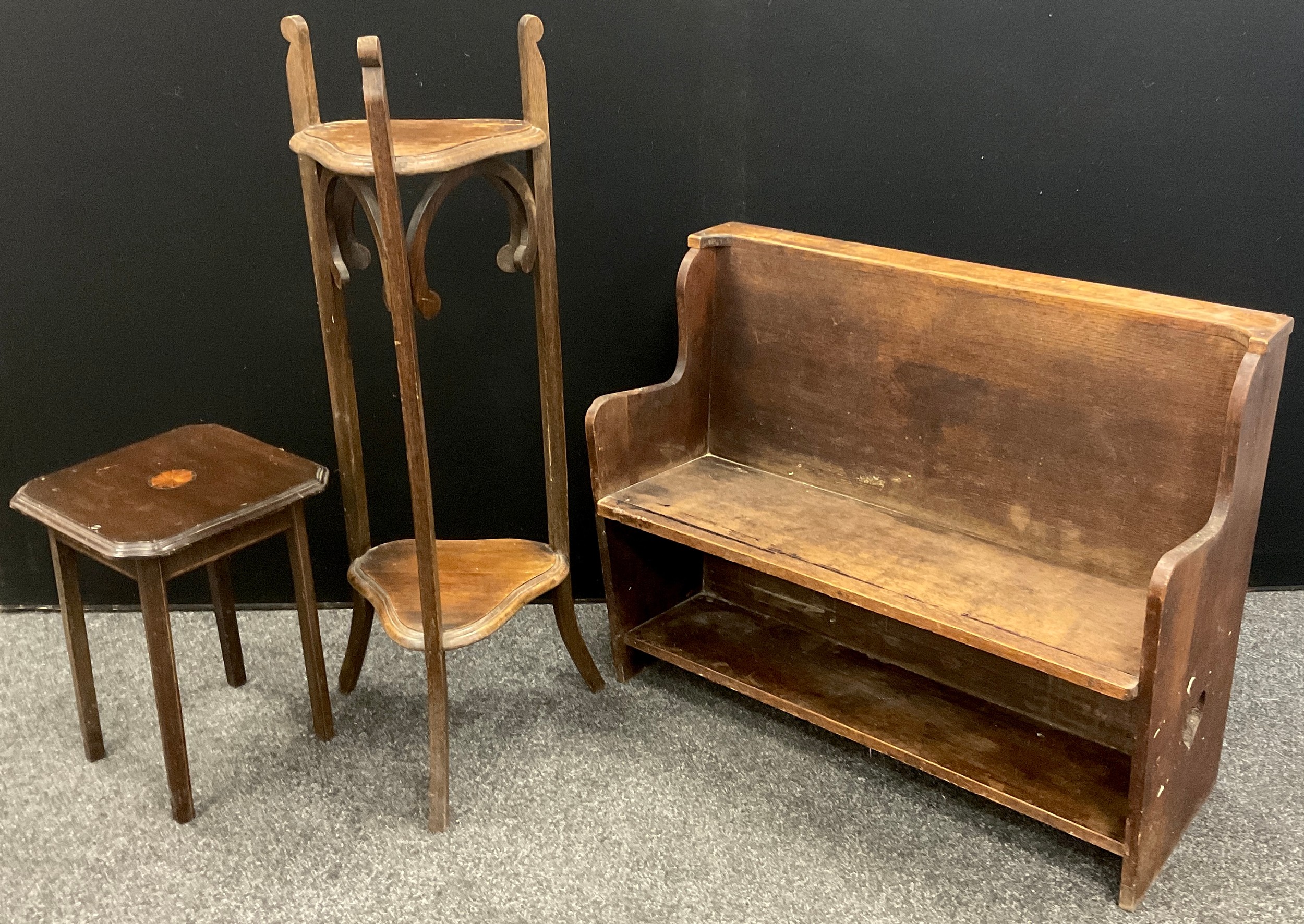 An early to mid 20th century Arts and Crafts style bijou hall settle, 71cm high x 88cm x 38cm; oak