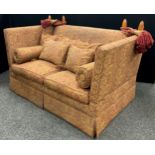 A Liberty and Co. style Knowle two seat sofa, of typical form with two loose cushion seats, six