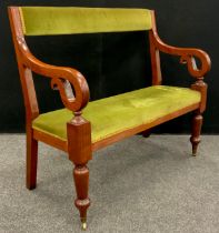 A Victorian mahogany settle, upholstered back and seat, scroll arms, turned legs, with brass casters