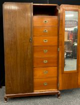 A mid 20th century mahogany compactum double wardrobe, fitted interior to one side with seven