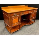 An early 20th century mahogany desk, quarter galleried top, three drawers to frieze, above a pair of