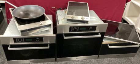 Professional Kitchen Appliances and Equipment - A Miele Oven, Miele Steamer Oven, and Miele food