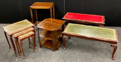 A nest of three tables, green leather tops, and a conforming coffee table; another similar coffee