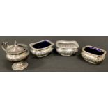 A pair of Victorian silver open salts, Birmingham 1896, another smaller 1903, two with blue glass
