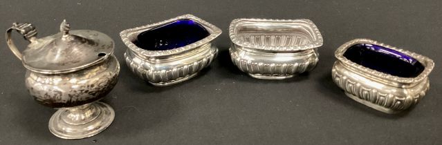 A pair of Victorian silver open salts, Birmingham 1896, another smaller 1903, two with blue glass