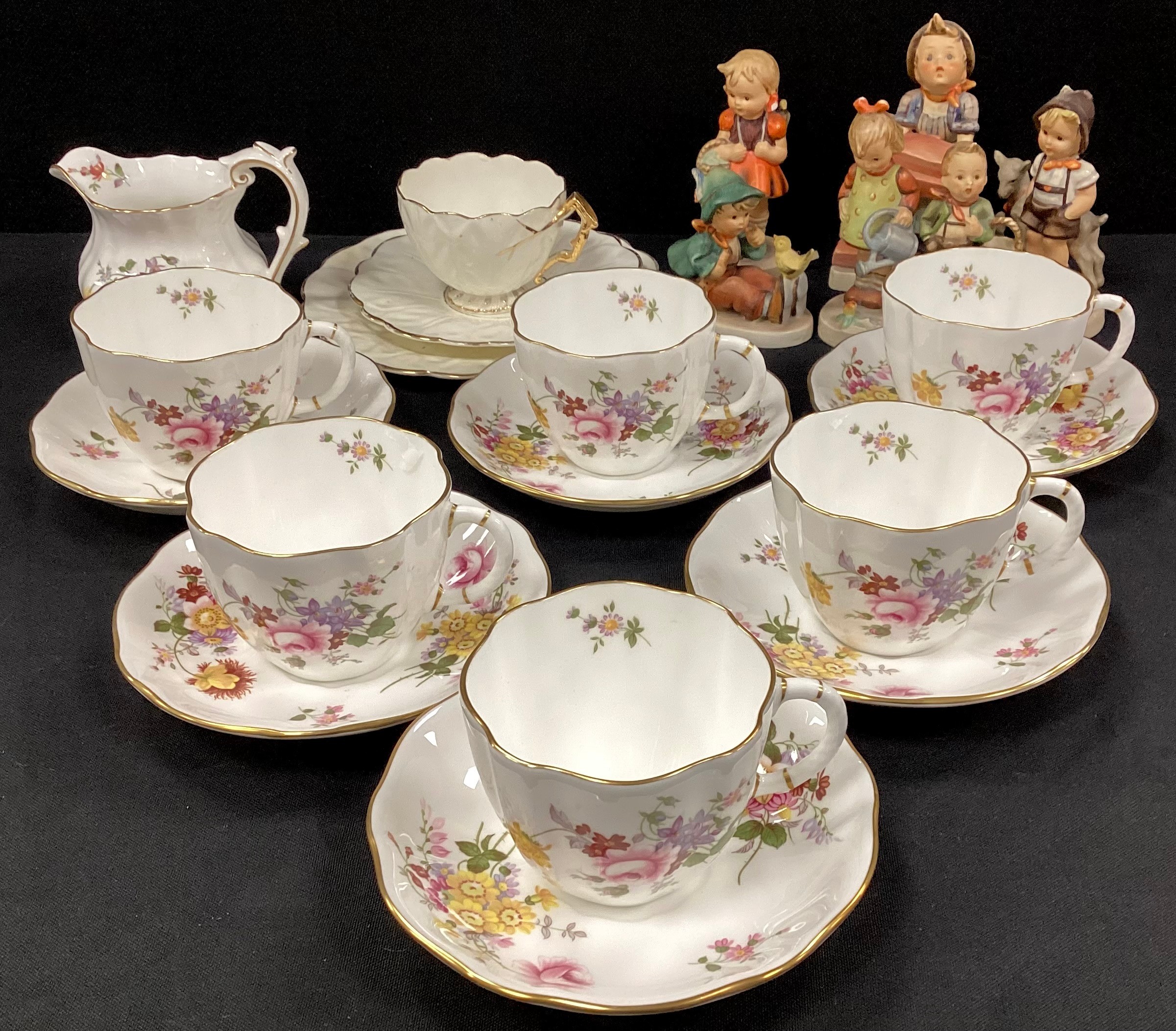 Six Royal Crown Derby ‘Derby Posie’ tea cups and saucers conforming milk jug; a group of six