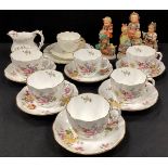 Six Royal Crown Derby ‘Derby Posie’ tea cups and saucers conforming milk jug; a group of six