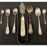 A pair of George III sugar tongs, Peter & William Bateman, London 1814; straining spoon 1814; carver