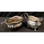 A George V silver cream jug, Henry Wigfull, Sheffield 1919; a gadrooned twin handle sugar bowl,