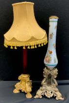 A late Victorian hand painted milk glass lamp stand, silver metal baroque style stand, 62cm high;