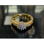 A diamond cluster ring, set with twenty five round brilliant cut diamonds, 18ct gold shank, size