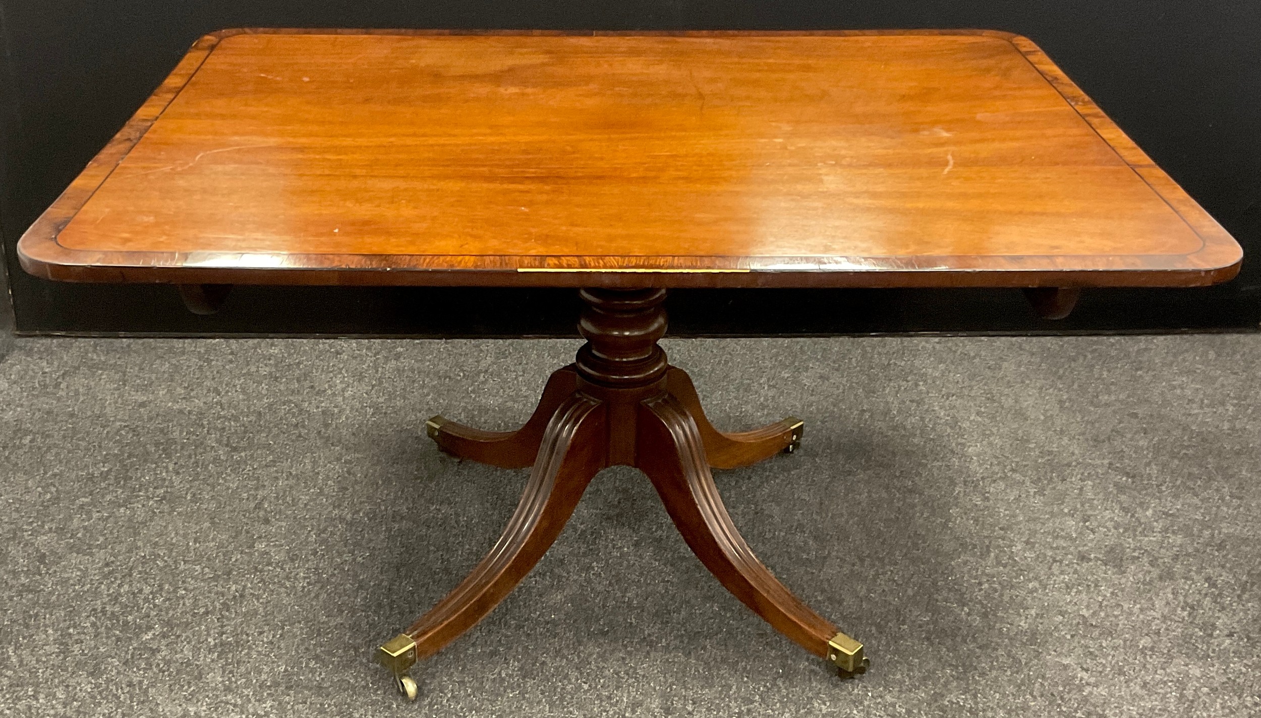 A 19th century mahogany rounded rectangular breakfast table, 71cm high x 133.5cm x 97.5cm. - Image 2 of 3