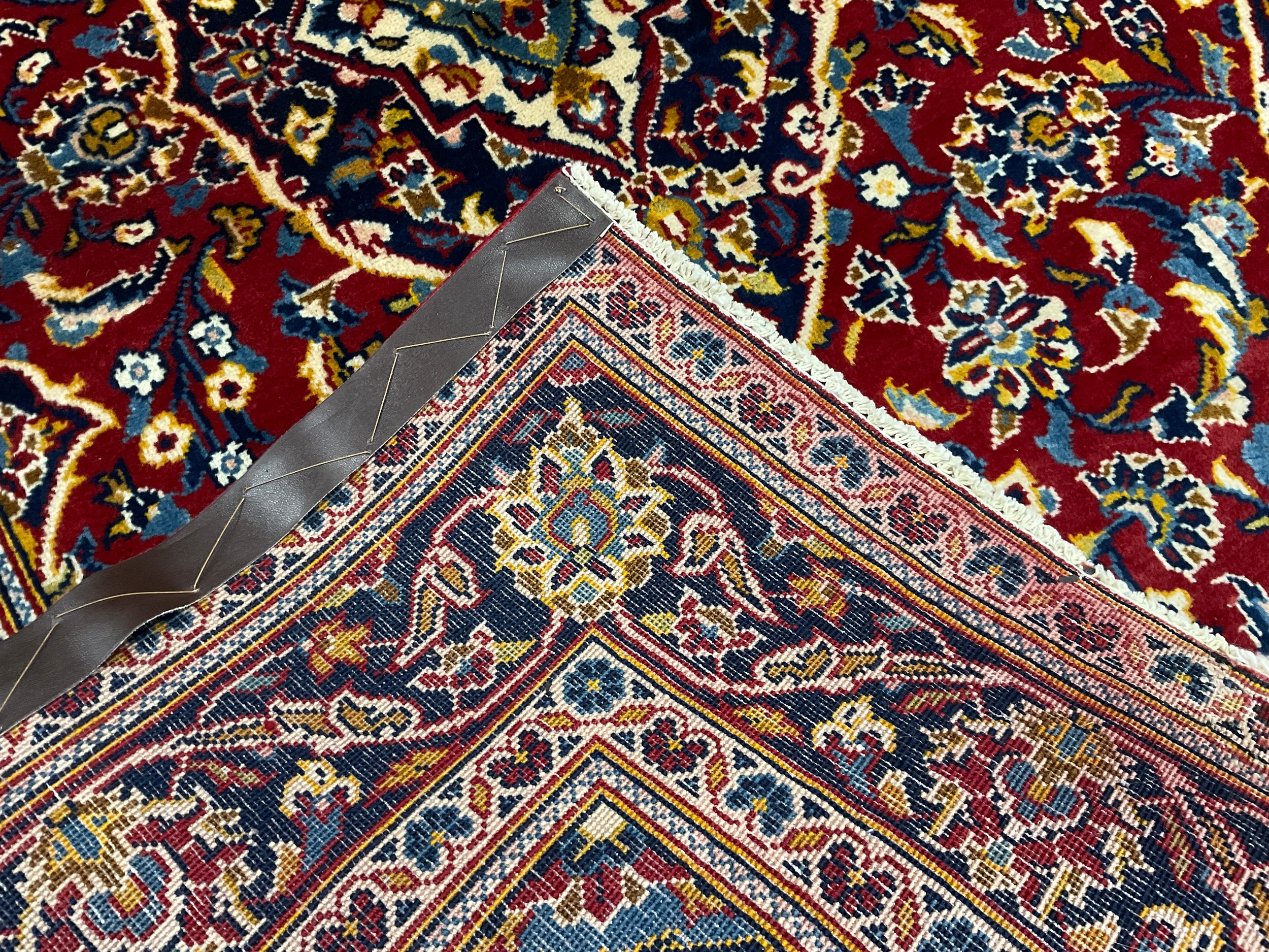 A Central Persian Kashan rug / carpet, hand-knotted with navette-shaped medallion, within a field of - Image 2 of 2
