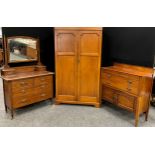 An Edwardian inlaid mahogany three-piece bedroom suite, comprising double wardrobe, 188cm high x