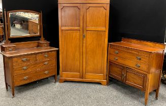 An Edwardian inlaid mahogany three-piece bedroom suite, comprising double wardrobe, 188cm high x