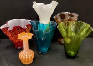 An Art Glass handkerchief vase, in mottled amber and clear colour tones, others red, blue, green