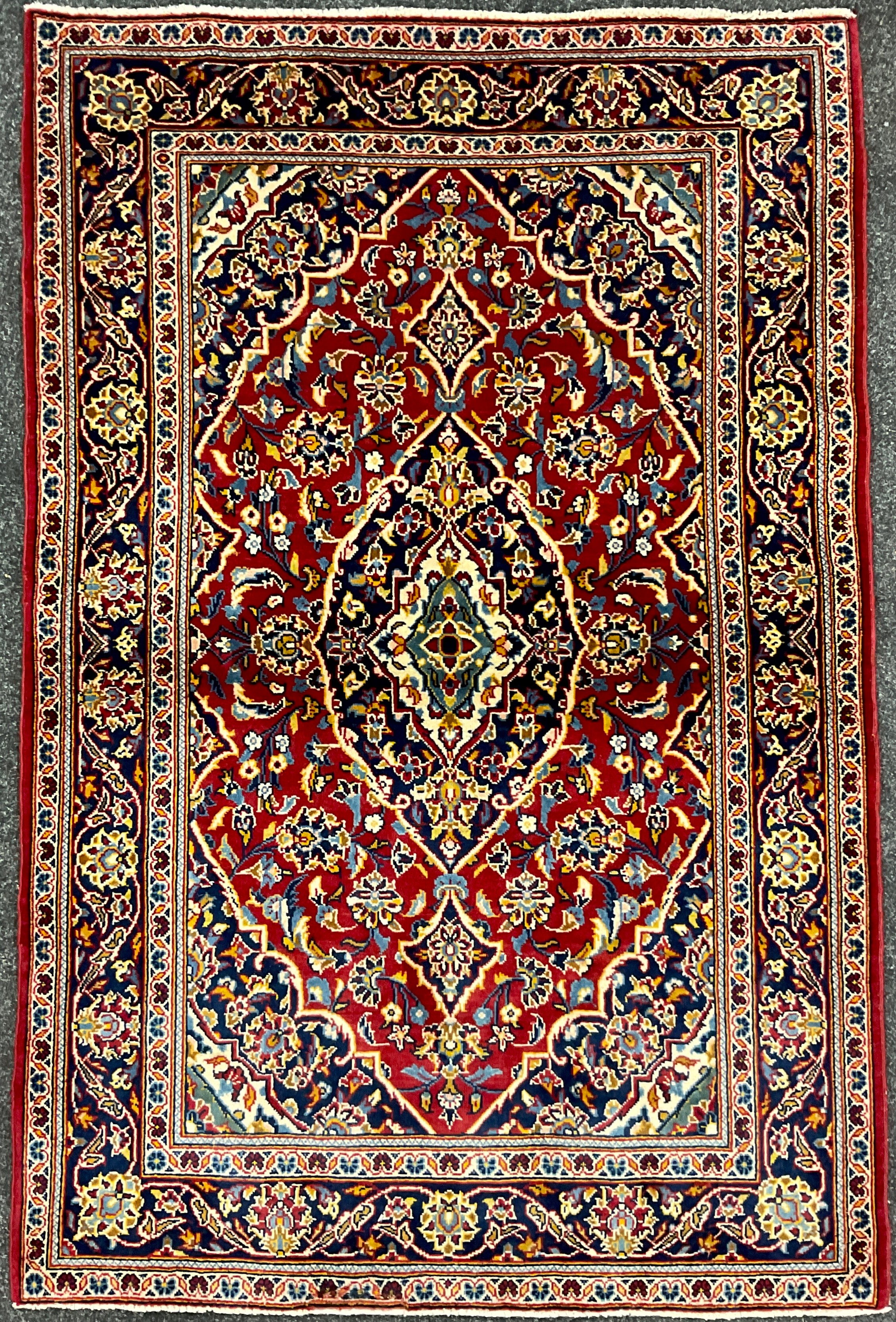 A Central Persian Kashan rug / carpet, hand-knotted with navette-shaped medallion, within a field of