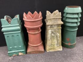 Architectural salvage - a crown top chimney pot, 72.5cm high; a Louvre chimney pot, 77cm high; two