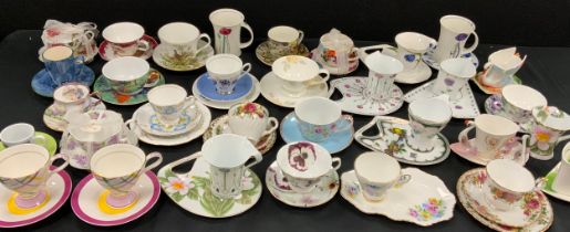 A quantity of floral and patterned tea cups and saucers including; The Leonardo Collection,