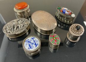 An oval silver pill or snuff box, import marks, London 1992; others embossed , carnelian topped,