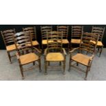 A long set of nine ladder-back elm and stained beech chairs, comprised of six chairs, and three