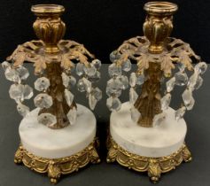 A pair of gilt metal candlesticks, baroque decoration with branches of descending glass bead