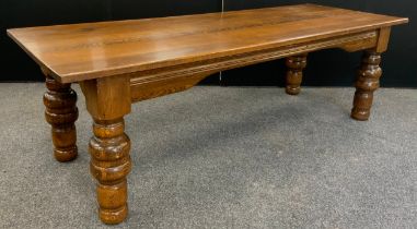 A large oak plank top dining table, thick solid oak top, raised on broad turned legs, 76.5cm high