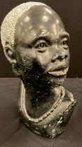 A carved African stone Bust, as a Lady, 32cm high.