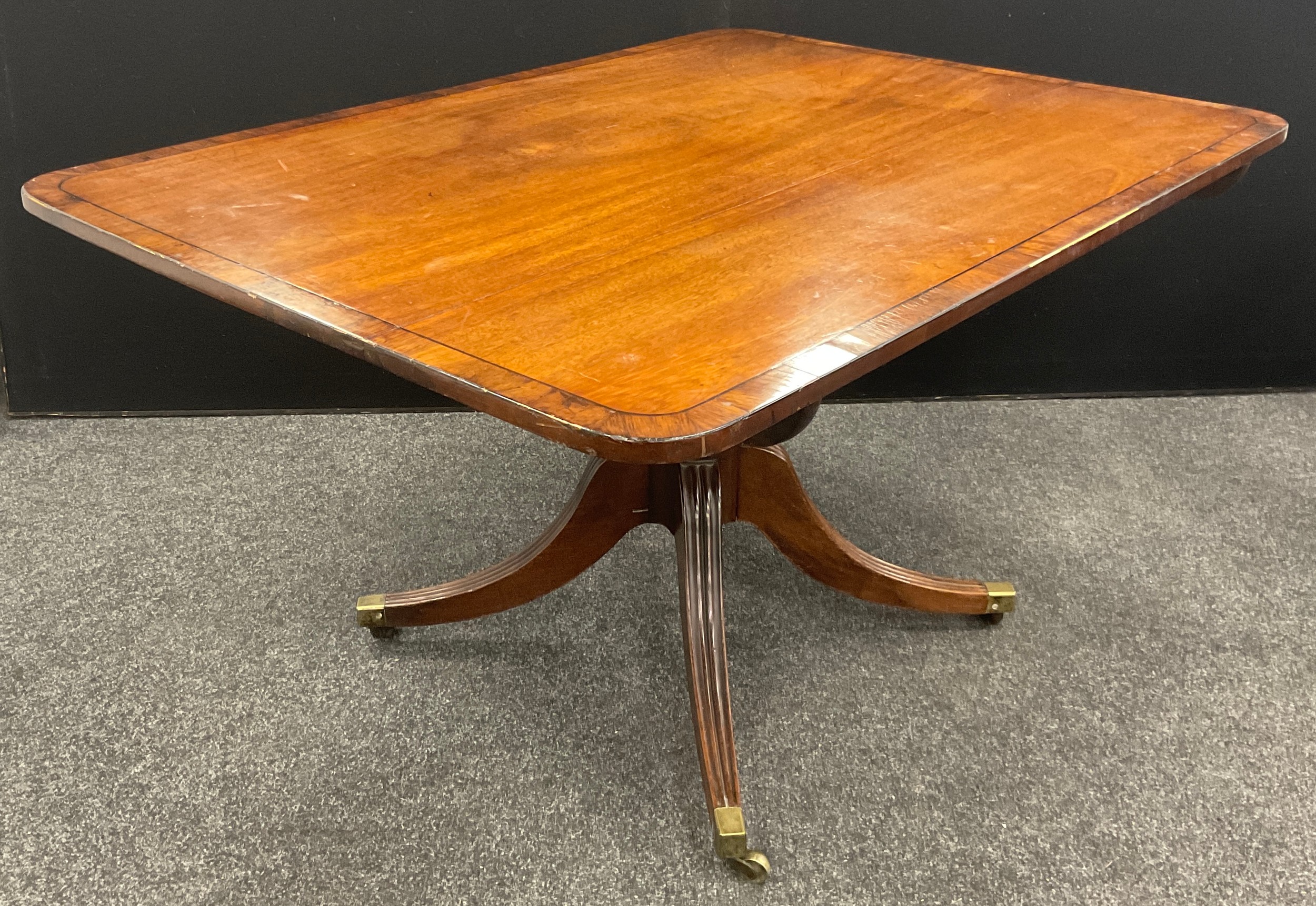 A 19th century mahogany rounded rectangular breakfast table, 71cm high x 133.5cm x 97.5cm. - Image 3 of 3