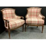 A pair of tartan upholstered armchairs, serpentine shaped backs, with scroll arms, upholstered backs