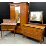 An Edwardian three-piece mahogany bedroom suite - single wardrobe with glazed door to centre,