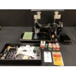 A Singer sewing machine, model 221KI, in case, with instruction manual, manufacture number