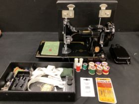 A Singer sewing machine, model 221KI, in case, with instruction manual, manufacture number